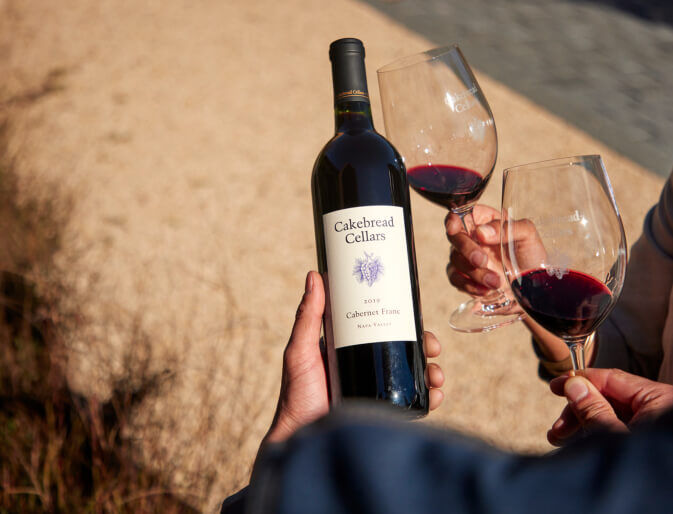 A bottle of Cakebread Cellars Cabernet Franc and two glasses